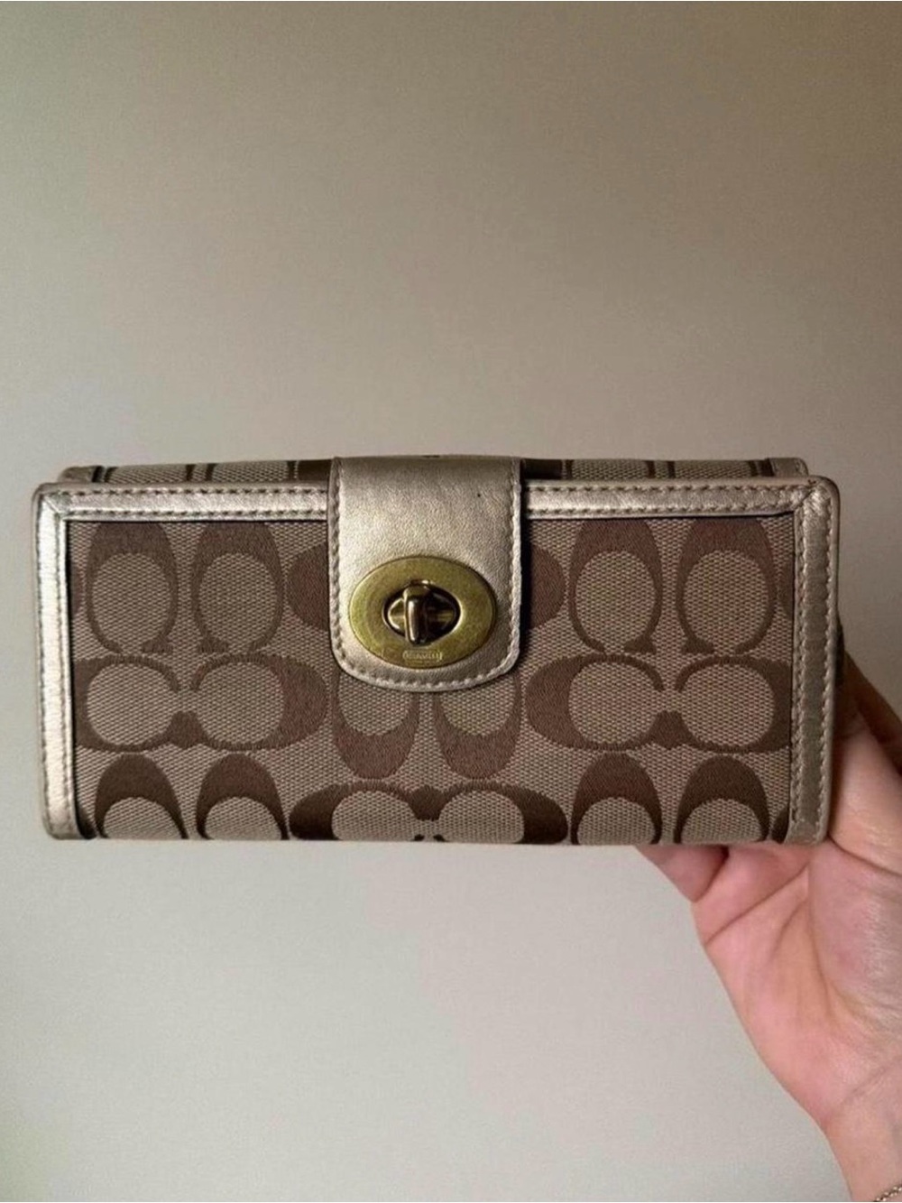 coach brown signature canvas turnlock wallet with metallic trim